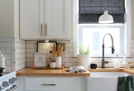 modern kitchen showing wood countertop and metal fixtures